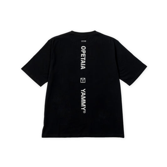 A black short-sleeve t-shirt shown from the back, featuring vertical white text reading 'OPETAIA' and 'YAMMY®' with a small square logo between them, plus a small number '2256' near the collar.