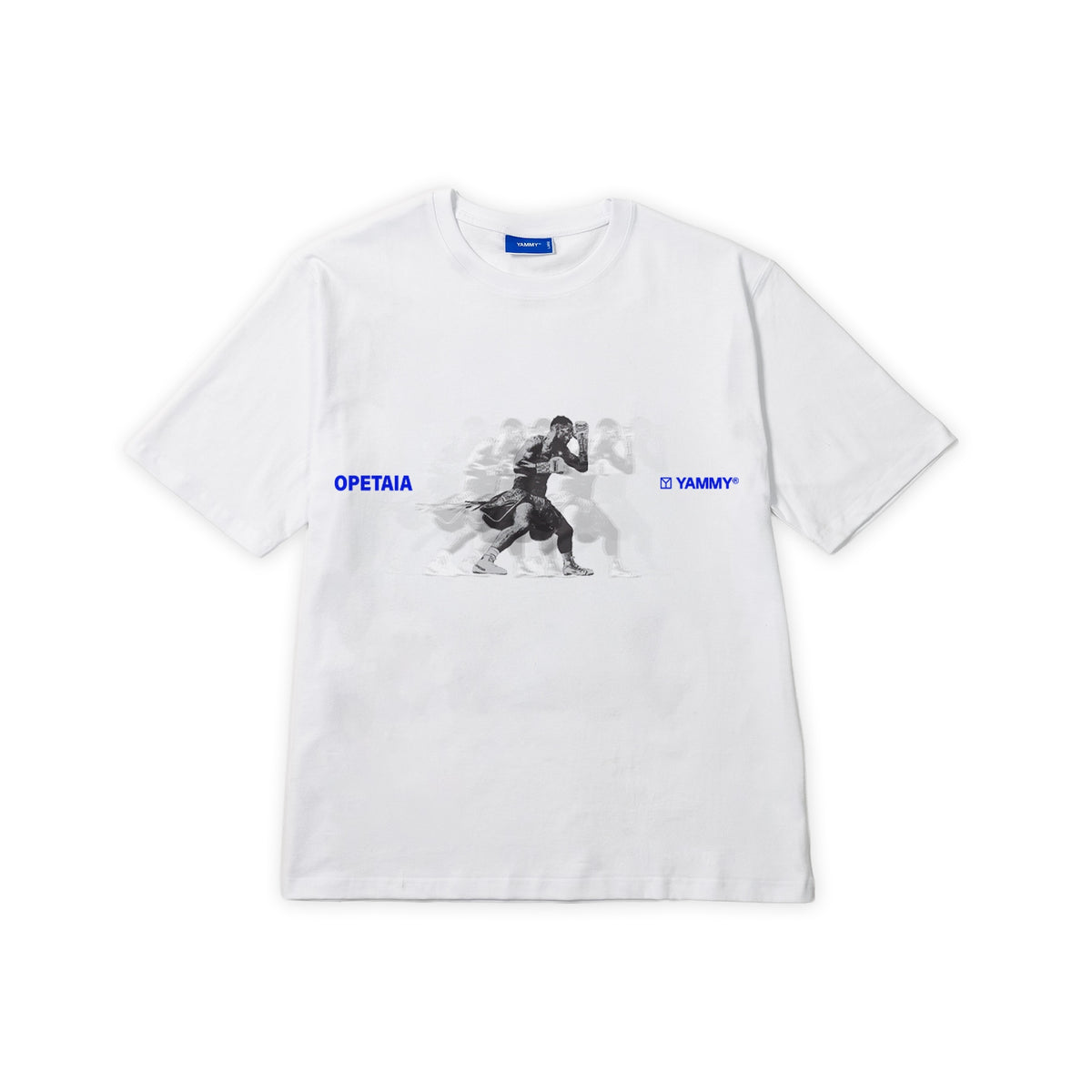A white short-sleeve crewneck t-shirt featuring a central graphic of Jai Opetaia in black and white, with blue text reading 'OPETAIA' on the left chest and 'YAMMY' on the right chest.