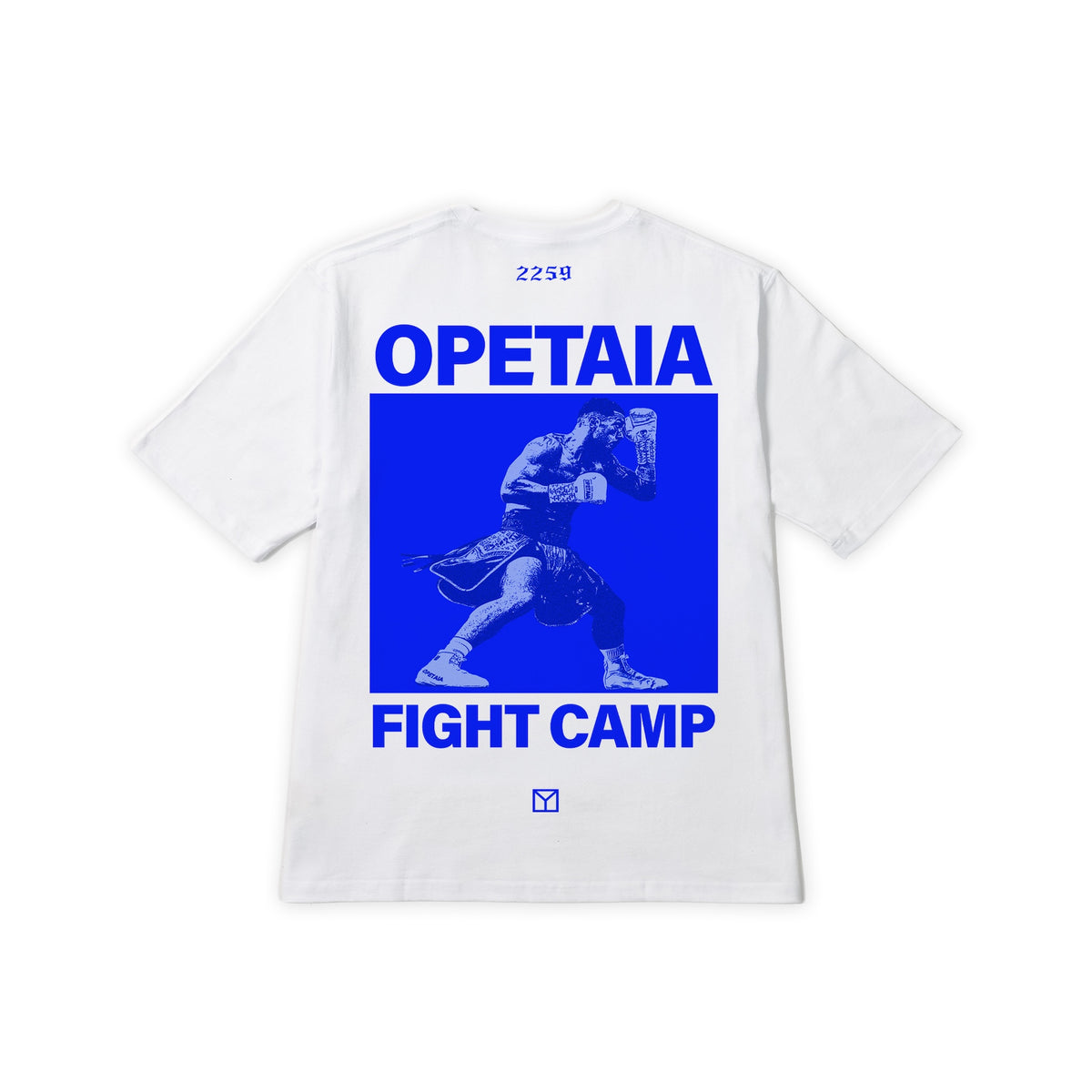 A white short-sleeve t-shirt shown flat against a white background, featuring a large blue graphic print on the back with the text 'OPETAIA FIGHT CAMP' and a blue-toned illustration of a martial artist.