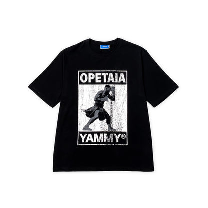 A black short-sleeve t-shirt with a distressed white graphic print on the front featuring Jai Opetaia and the text 'OPETAIA' and 'YAMMY'.