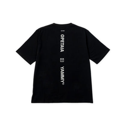 A black short-sleeve t-shirt shown from the back, featuring vertical white text reading 'OPETAIA' and 'YAMMY®' with a small square logo between them, plus a small number '2256' near the collar.