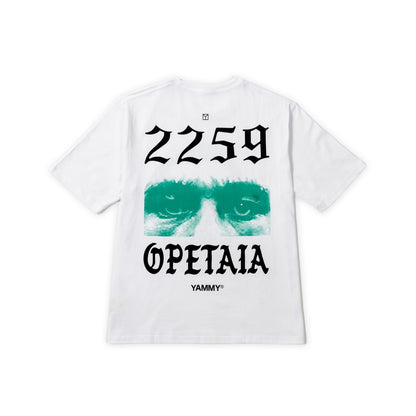 A white short-sleeve t-shirt shown flat against a white background, featuring a graphic print on the back with the text '2259 OPETAIA' and 'YAMMY' in black, and a green graphic of sunglasses.