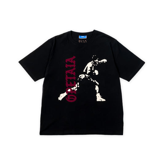 A black short-sleeve graphic t-shirt by Uss, featuring a distressed white silhouette of Jai Opetaia and vertical red text reading 'OPETAIA' on the front, laid flat against a white background.