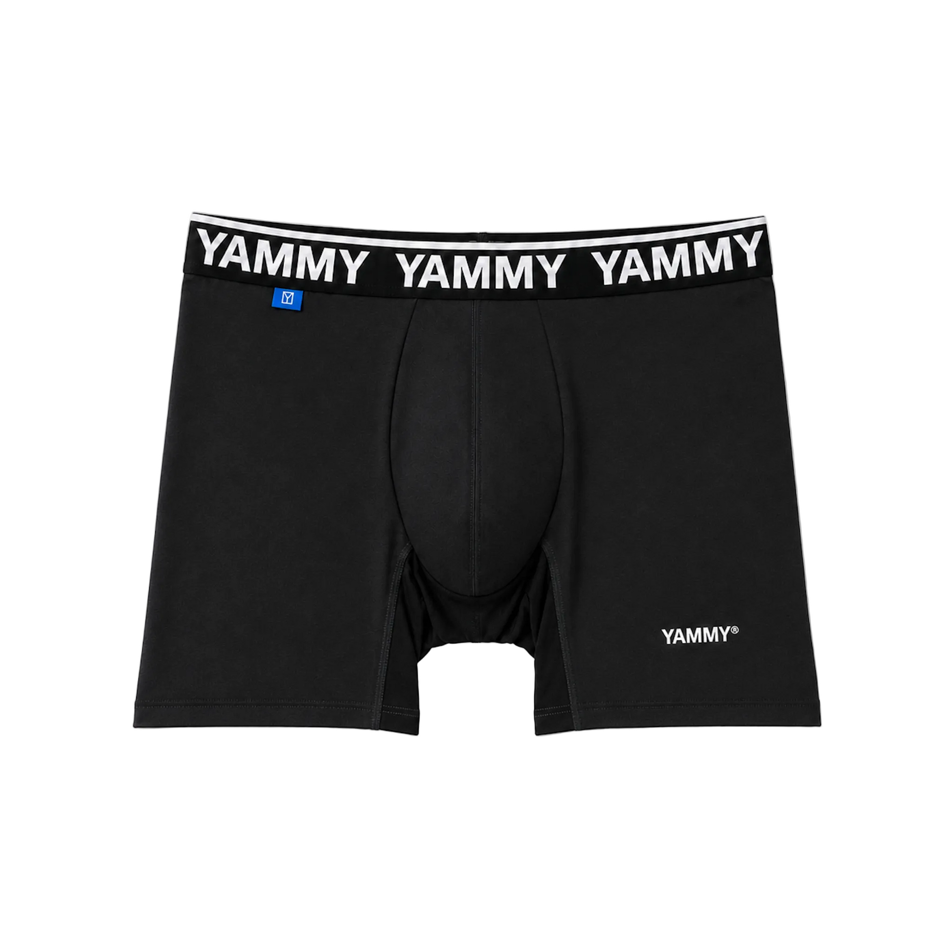 Black boxer briefs with a white elastic waistband featuring the brand name 'YAMMY' repeated in white, plus a small blue size tag and a white YAMMY logo near the lower right leg.