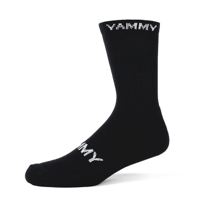 A single black crew sock with white 'YAMMY' text printed on the top cuff and foot, shown on a clean white background.