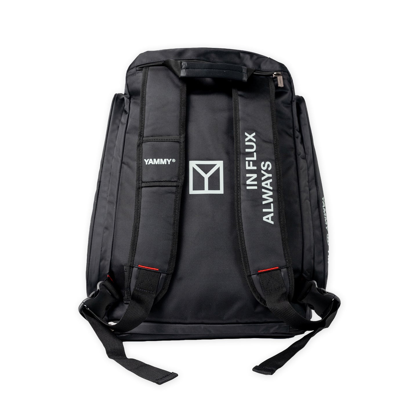 Black backpack shown from the back, featuring white printed branding including 'YAMMY', a large Y logo, and 'ALWAYS IN FLUX' on the shoulder straps, set against a plain white background.