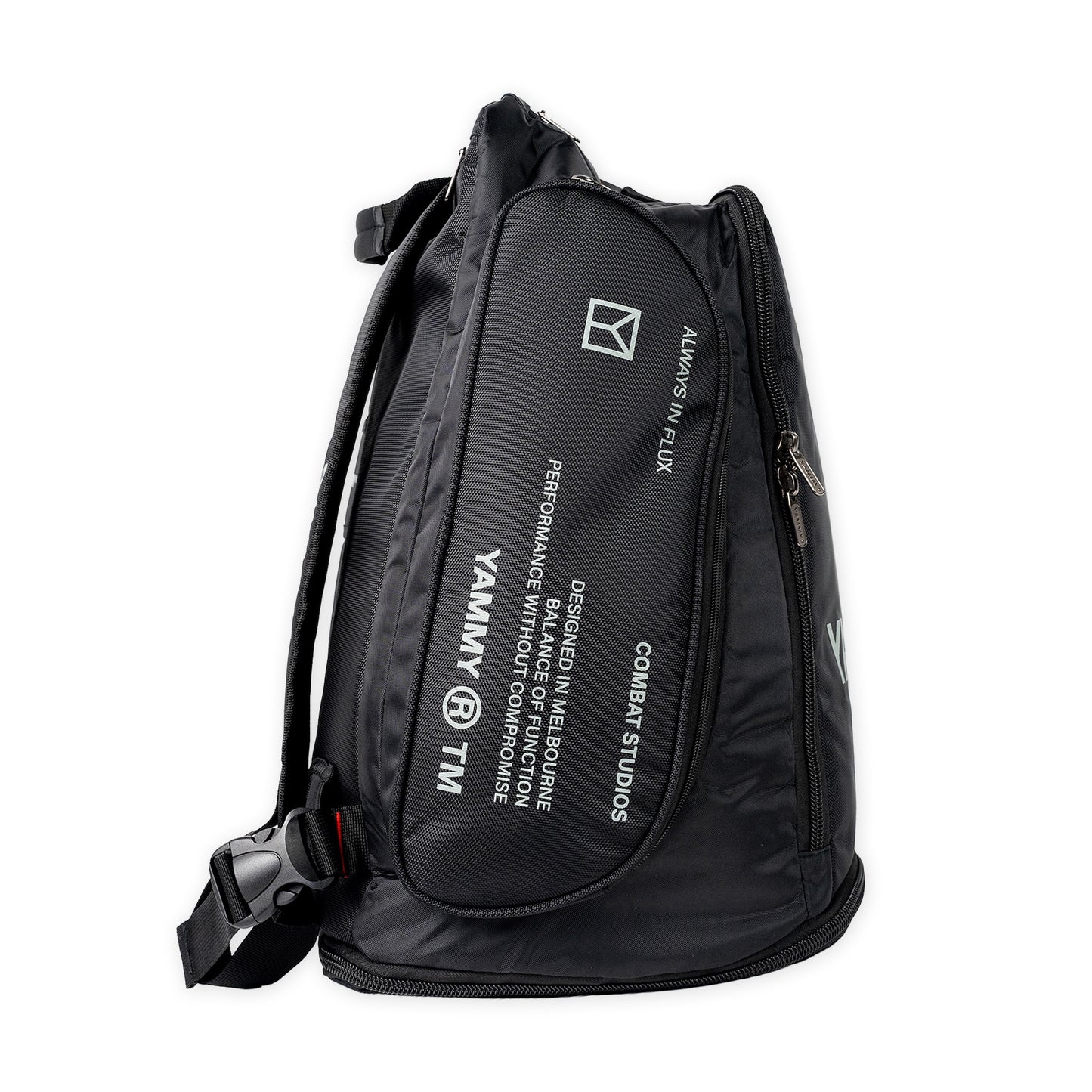 A black nylon backpack with white printed text and logos, including 'YAMMY' and 'COMBAT STUDIOS', shown on a plain white background.