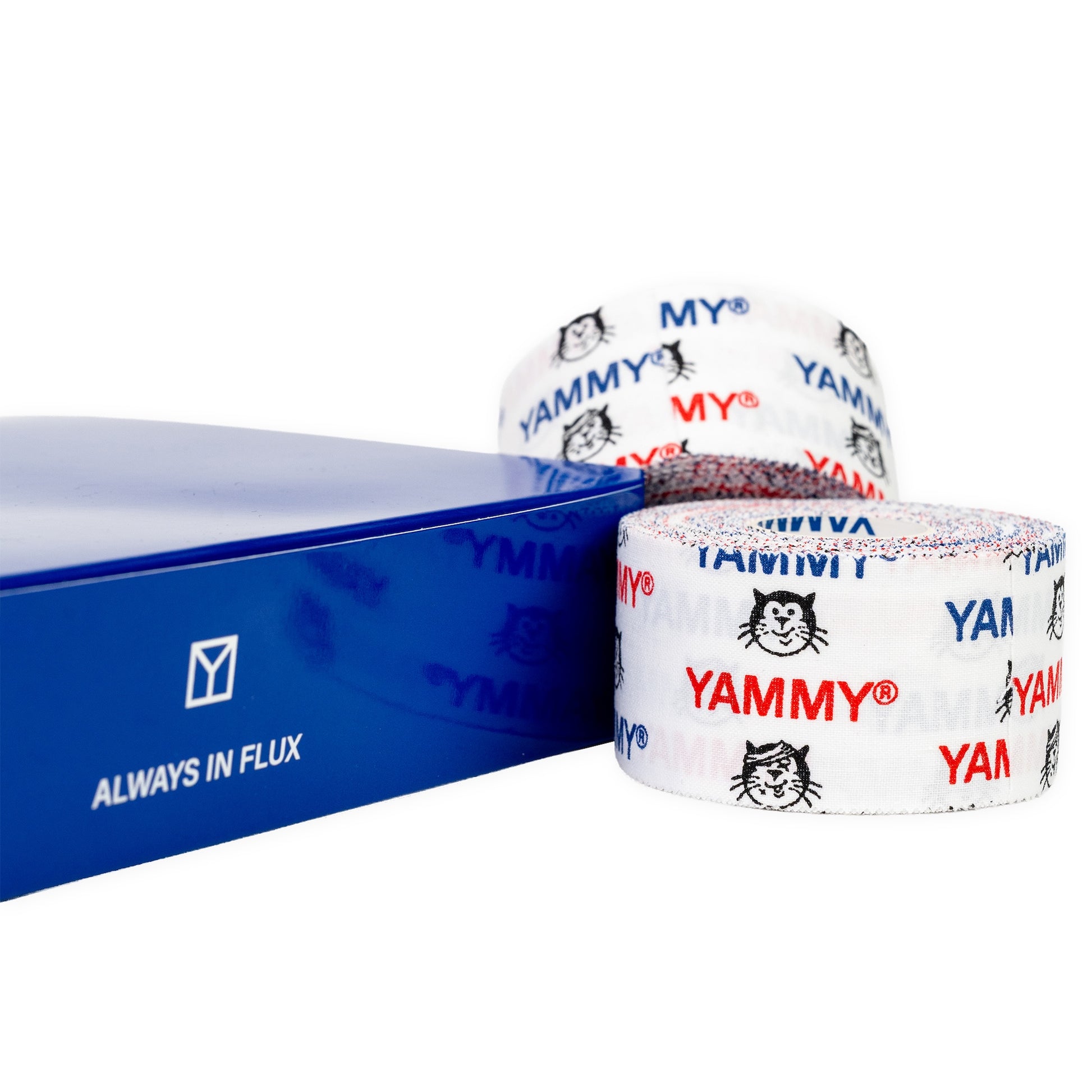 Two rolls of white YAMMY brand tape with red and blue lettering and a black cat logo, displayed next to a blue box with 'ALWAYS IN FLUX' text on a white background.